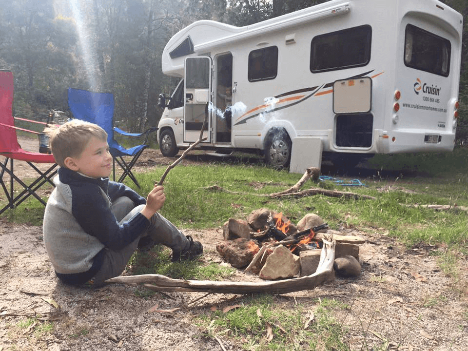 Kid by Fire Outdoor Camping